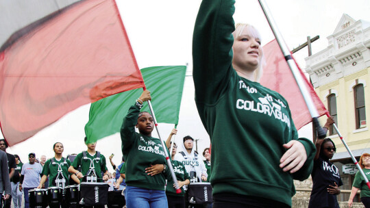 The Taylor High School Color Guard waved flags during the MLK Day march through south Taylor to Heritage Square in downtown. Photo by Jason Hennington