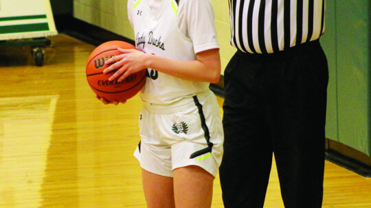 Lady Ducks sophomore Sophia Fisher checking the ball in. Photo By Evan Hale