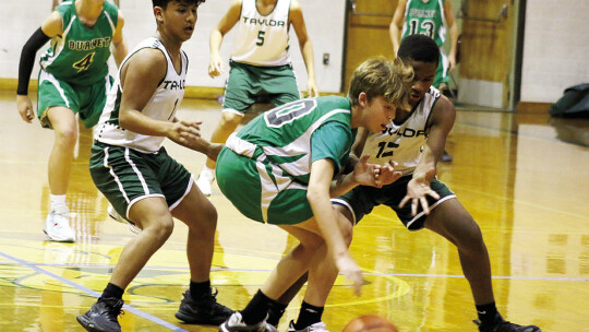 Paulo Torres (left) and Damien Calico trap a Burnet player to cause a turnover Thursday night.