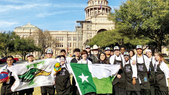 Taylor High School culinary instructor, Chef Mike Erickson, and his culinary Duck Brigade, gather for a photo Jan. 17 on the capital grounds where they assisted at the reception following the inauguration of Governor Greg Abbott. Courtesy photo