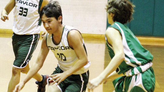 Davian Tellez (back) watches as Da’vion Kuhn leads a break against Burnet.