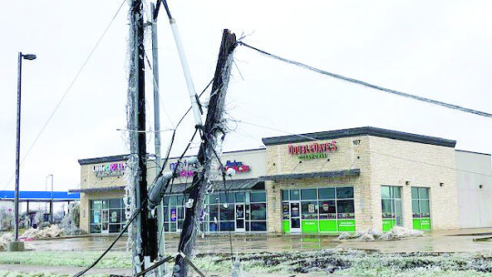 A damaged utility pole lies on the ground Feb. 2 along Carlos G. Parker Boulevard Northwest in Taylor. Photo by Ann Miller