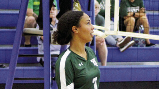 Left: Peyton Wamble hitting the ball to keep the point alive for her team. Right: Hannah Wamble getting to her defensive position awaiting for the ball to be served. Photos by Evan Hale