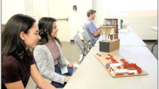 (From left) UT architecture students Nikki Gendelman and Nataly Serrano prepare to present their preliminary designs for a wellness center in Memorial Park Feb. 15 to their classmates as well as city staff and other interested community members at the parks and recreation facility at Davis...