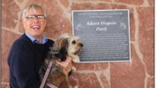 Author, historian and former Hutto mayor Mike Fowler with sidekick Rugby at the dedication.