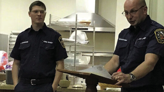 Speaking at a previous Coupland Civic Organization “state of the City” meeting are Jared Cummings, ESD#10 Assistant Chief, and John Roulston-Bates, District Chief of Station 1, Coupland. Photo by Susan Garry