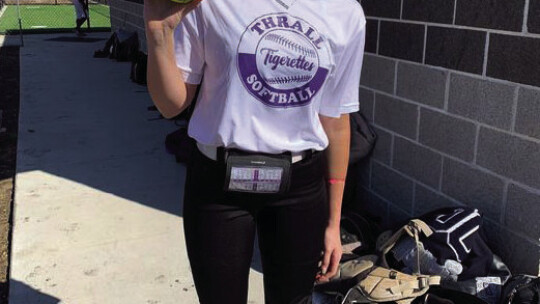 Raelynn Johnson takes a moment post-game to celebrate her third homerun of the season with a picture. Courtesy Photo