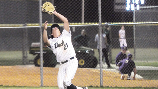 Ducks junior Braylan Alderete getting under a fly ball to secure an out for his team. Photos by Larry Pelchat