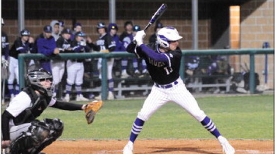 Jack Watson settling in to the batter’s box before making contact with the ball to get on base. Photo by Larry Pelchat