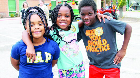 (From left) Draylah Winn, 8, with cousins Jurnii Wilson, 9, and Decayden Wilson, 10 at the Taylor Public Library’s Truck Petting Zoo March 16.