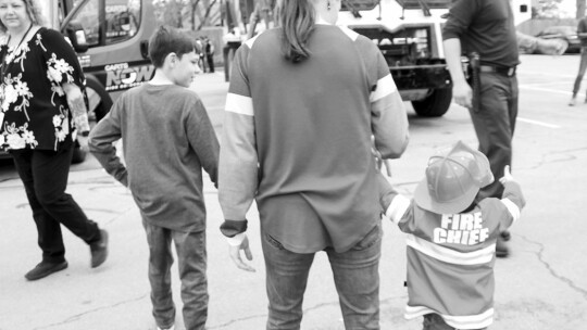 From left Stacy Davis, 11, walks with mom Ashley Reynold’s and little brother and future firefighter Declan Haussmann, 2, March 16.