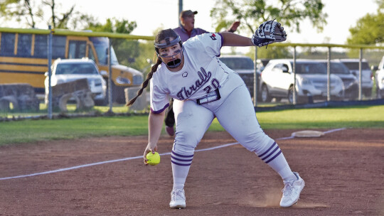 Tigerettes sophomore Bri Jarosek fielding a ground ball with her bare hand before throwing the runner out at first. Photo by Cristina Jarosek