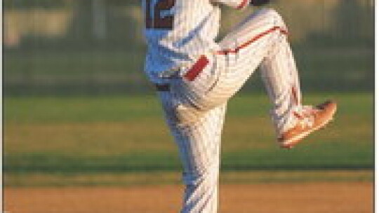 Ben Jamieson reeling back before delivering a strike to the batter. Photo by Larry Pelchat