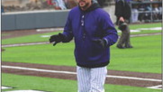 Tigers head baseball coach Aaron Vanecek motivating his team during the game. Photo by Evan Hale