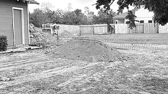 Photo of Marci Wagner’s home now. Wagner said the developer uprooted over 20 trees on her property and flooding destroyed landscaping. Photo source: Marci Wagner