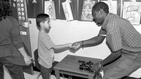 Back in 2019, Jason Hennington shakes hands with Evan Galvan during an interview for a feature page in the Taylor Press. Photo by Tim Crow