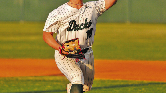 Ducks pitcher Chris Perez delivering a strike to strikeout a Caldwell batter. Photo by Larry Pelchat