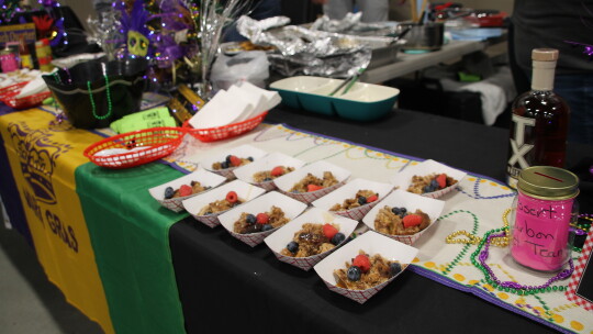 Syrissa Dominguez’s bread pudding topped with berries and a fiery bourbon honors Bourbon Street in New Orleans at the ‘Food Dudes’ charitable event.