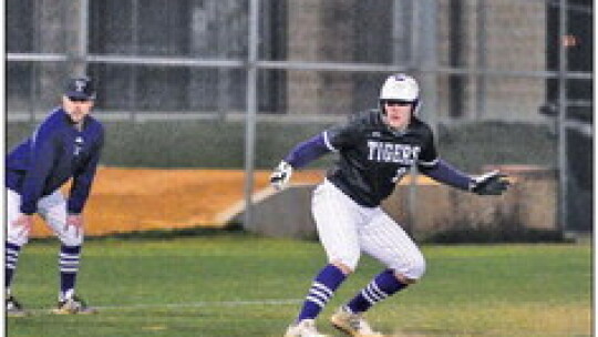 Asa Gibbs swinging and fouling a ball off to stay alive in the batter’s box. Photo by Larry Pelchat