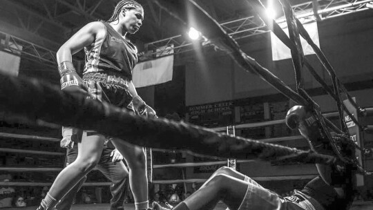 Destiny “Too Sweet” Jones stands over her opponent Clarice Reese Morales in the sixth round of their fight last week. Photo courtesy of iRULL FOTOS/FORCERTAIN PROMOTIONS