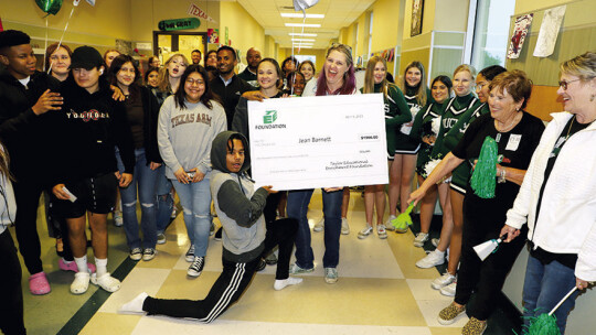 Taylor High School art teacher, Jean Barnett, and her students celebrate receiving a TEE Foundation grant for the school’s ceramics program.