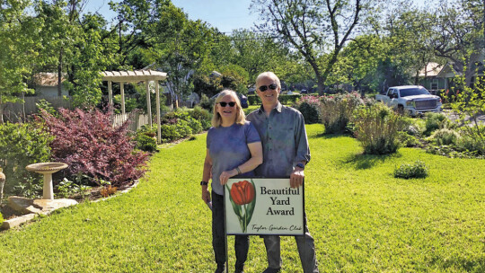 Jeanette and Mark Platz stand in their yard at 1016 Alexander Street in Taylor, which was chosen as the Beautiful Yard of the Month. Courtesy photo