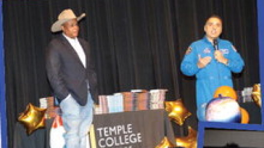 Former NASA Astronaut Jose Hernandez is accompanied by Taylor City Councilman Gerald Anderson during the question-and-answer part of the presentation.