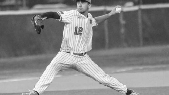 Ben Jamieson stepping towards the batter to throw a strike for a strikeout. Photo By Larry Pelchat