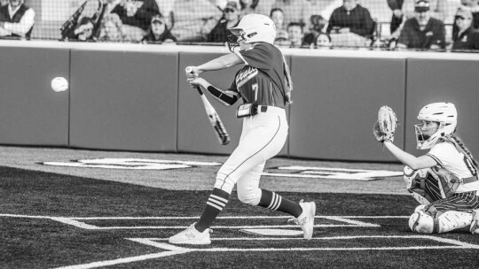 Autree Kelm steps into a pitch and sends the ball to deep right field for an extra base hit. Photo By Larry Pelchat