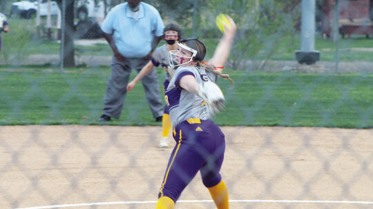 Payton Filla stepping into a pitch to strike out another batter.