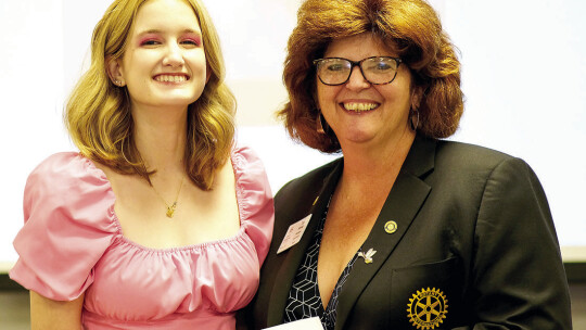 Taylor Rotary Club President Tia Stone (right) presents the $6,000 Bunnell-Rotary Scholarship to Eva White, a senior at Legacy Early College High School in Taylor at the May 1 Rotary Scholars Banquet.