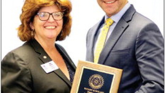 Chad Cryer (right), who teaches at Legacy Early College High School, received the Distinguished Educator Award from Rotary President Tia Stone at the May 1 Rotary Scholars Banquet. This winner is selected by the top 10 percent of the students in this year’s graduating class. Courtesy photo