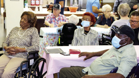 (From left) Lessie Givens, Bobbie Nickerson, Pastor Anthony Watson and Don Hill watch A Life of Service, and interview with Givens.