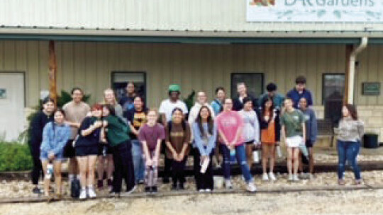 A group of Taylor High School students and counselor Laurie Morris visit Down Home Ranch in honor of a Columbine Day of Service.