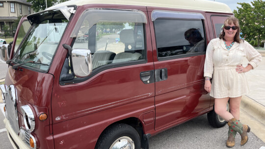 Master of Ceremonies of Blackland Prairie Day, Martha Van Garza stands next to her 1966 antique Japanese micro van Saturday, May 6 at Heritage Square, 400 N. Main St.