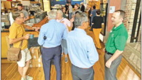 Taylor Police and attendees chat over a cup of joe during “Coffee with a Cop” held May 10 at Good Strangers. Photo by Kendra Maness