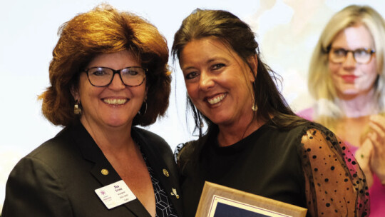 Taylor Rotary Club President Tia Rae Stone presents Distinguished Educator Award to Coach Shelli Cobb, of Taylor High School at the May 1 Rotary Scholars Banquet. This winner is selected by the top 10 percent of the students in this year’s graduating class. Courtesy photo