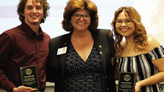 Taylor Rotary Club President Tia Rae Stone (center) presents the Extracurricular Awards to Jett VanBrocklin (left) and Soryna McIntire, seniors at Taylor High School at the May 1 Rotary Scholars Banquet. Courtesy photo