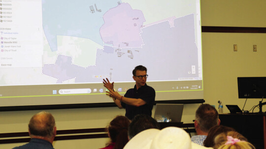 Chris Johns, attorney, explains the different areas of the Taylor map, including the ETJ and the area that Manville Water services. Photos by Edie Zuvanich