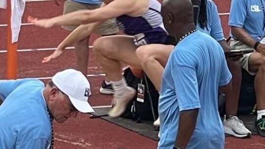    Melaina Grissom completing her jump during the Triple jump event. 