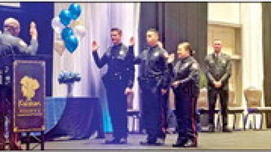 Chief Jeffrey Yarbrough swears in newly-graduated officers Connor Bloore (left), Eranee Gonzalez and Alexia Casanova. Source: City of Hutto