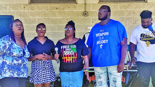 Salvation Church choristers Gloria Roberson (left), Trinity Roberson, Ashley Coulter, Thomas Lyons and Markell Irvin sing gospel music at the 2017 Juneteenth celebration at Fannie Robinson Park in Taylor. Photo by Nakevia Miller