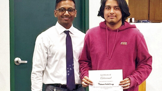 Richard Dela Cruz (right) is one of the students who received a certificate for completing the final semester at TASC.