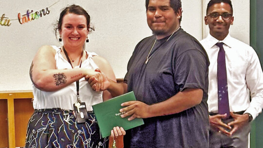 Omar Castro (center) received his high school diploma after completing the final semester at TASC. Photos by Tim Crow