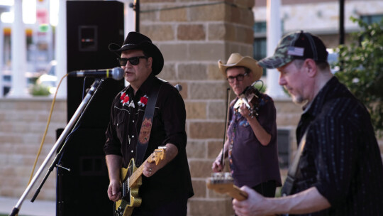 (From left) Mike Porterfield, Marty Starns and Dave DaVegas of Hard Luck Revival perform in the first Music on Main concert of the spring 2023 series. Photo by Richard Stone