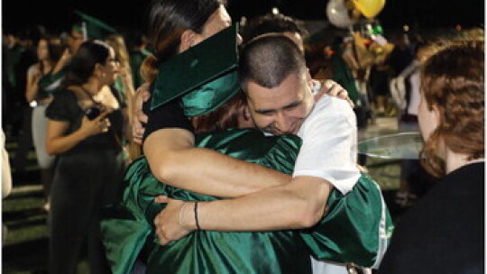 Families celebrate the senior class of 2023 out on the stadium field. Photos by Tim Crow