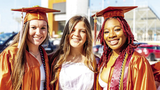 (From left) Hailee Sanchez, Adriana Turnipseed and Tirza Pitt celebrate the end of their high school career at graduation.