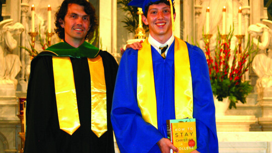 Daniel Vincent recieves the G.K Chesterton Award from faculty member Andrew Kinney at the St. Mary’s Graduation Ceremony Thursday, May 25. Photos by Grace Horvath