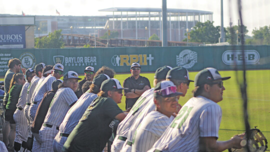 BELOW: Players and coaches from Taylor varsity baseball eagerly await the start of Game 1 of the 4A Region 3 Finals held at Baylor Ballpark. Photos by Andrew Salmi