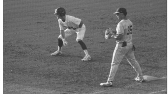 Ducks varsity baseball senior outfielder Conner Barcuch takes a lead off first base during Taylor’s 3-0 victory in Game 1 vs. China Spring.